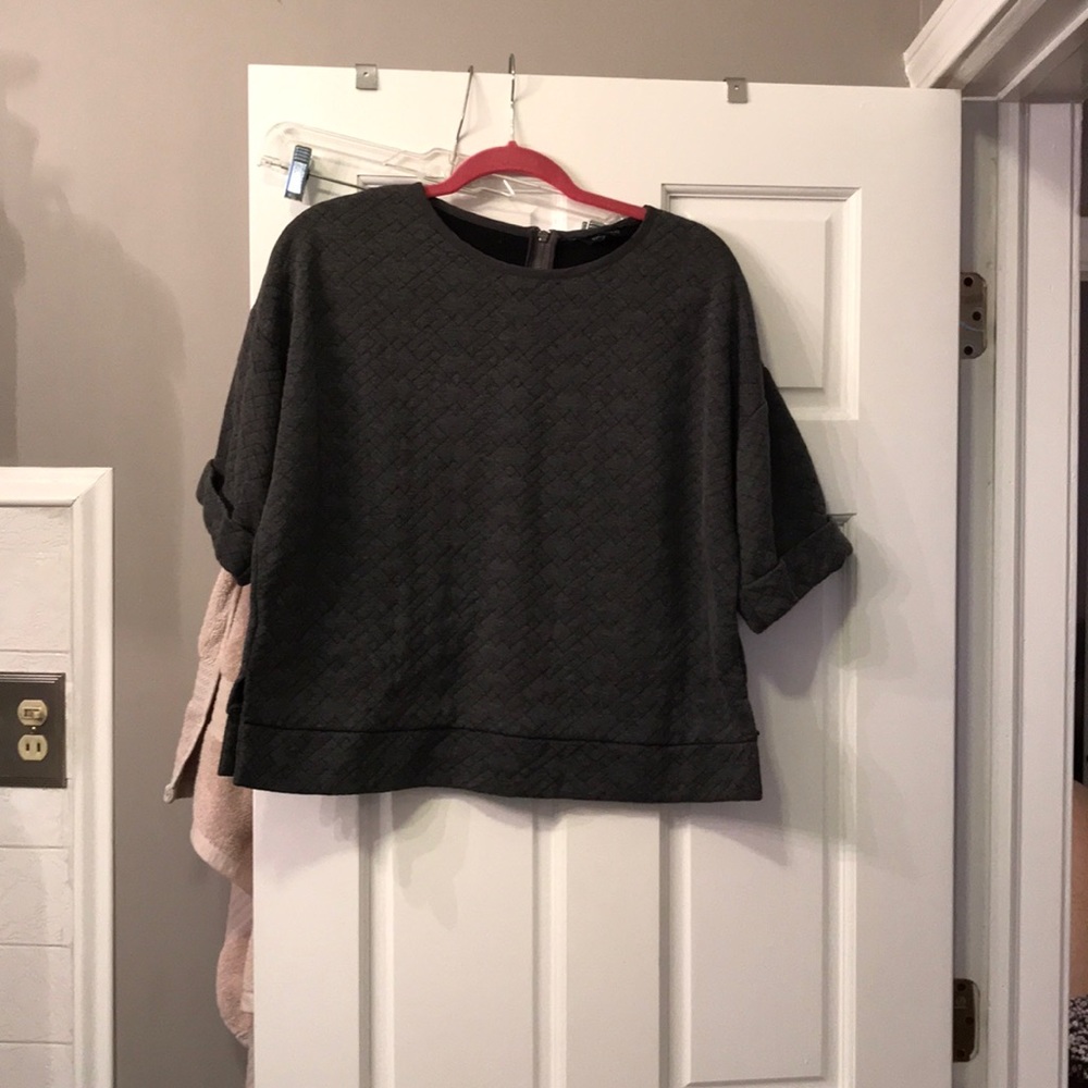 Gray quilted cropped top with exposed zipper